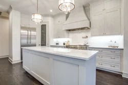 White kitchen design with marble countertops