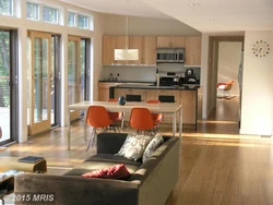 Living room kitchen design with floor-to-ceiling windows