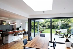 Living room kitchen design with floor-to-ceiling windows