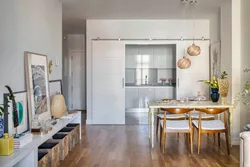 Design of a one-room apartment with a kitchen in a niche