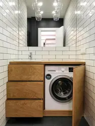 Bathtub design with a niche for a washing machine
