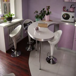 Kitchen design with a round table in Khrushchev