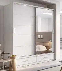 Bedroom wardrobe design in a modern style without mirrors
