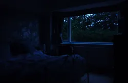 Photo of a room at night in an apartment