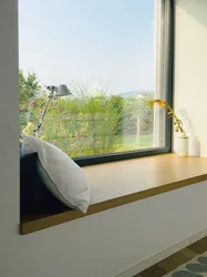 Photo of plastic windows in an apartment with a window sill