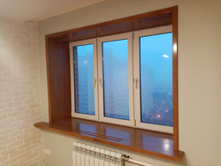 Photo of plastic windows in an apartment with a window sill