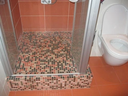 Do-it-yourself shower in an apartment made of tiles photo