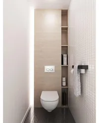 Design of a toilet in an apartment with a cabinet and tiles