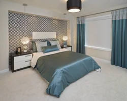 Curtains In The Interior Of A Bedroom With A Gray Bed