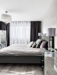 Curtains In The Interior Of A Bedroom With A Gray Bed