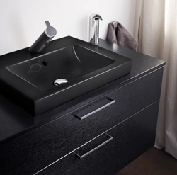 Bathroom design with black cabinet
