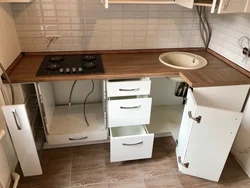 Kitchen design with refrigerator and table