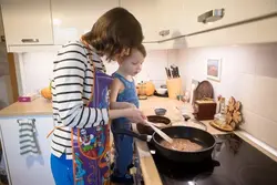 Photo of my mom at home in the kitchen