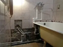 Photo Of Bathtub Tiles And Pipes