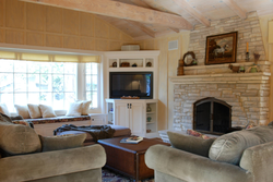 Living rooms with fireplace by the window photo