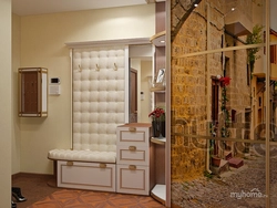 Hallway closet with ottoman photo