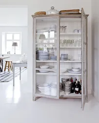 Kitchen utensils behind glass photo