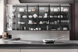 Kitchen utensils behind glass photo