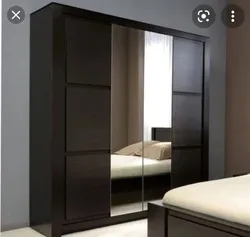 Dark wardrobes in the bedroom photo