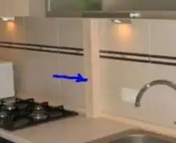 Photo of kitchen pipes in countertop