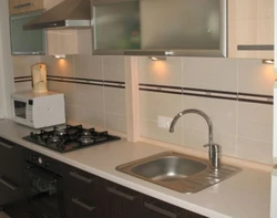 Photo of kitchen pipes in countertop
