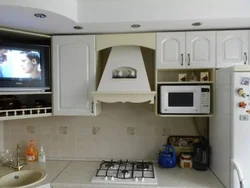Kitchen photo with microwave and TV