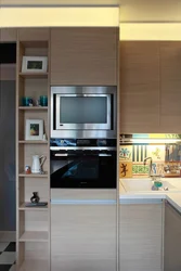 Kitchen photo with microwave and TV