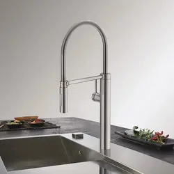 Stainless steel kitchen faucet photo