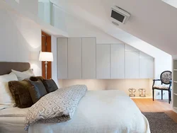 Sloping walls in the bedroom photo