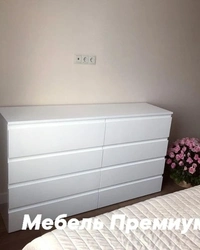 Glossy chest of drawers in the bedroom photo