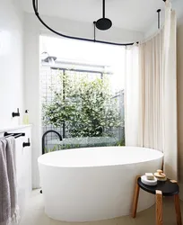 Small bathtubs with curtains photo