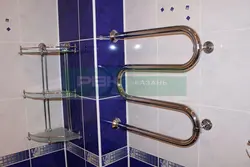 Heated towel rail pipe in the bathroom photo
