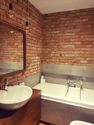 Bathtub with brick panels photo