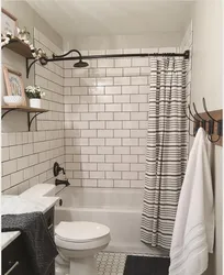 Bathtub with brick panels photo