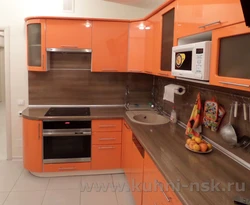 Orange kitchen black countertop photo