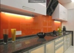 Orange kitchen black countertop photo