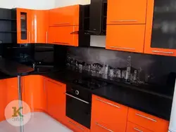 Orange kitchen black countertop photo