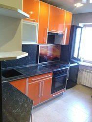 Orange Kitchen Black Countertop Photo