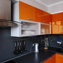 Orange kitchen black countertop photo
