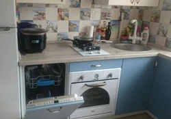 Kitchen photo with refrigerator, dishwasher