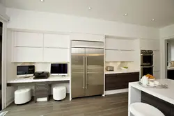 Photo Of A Kitchen With A Refrigerator And A Table