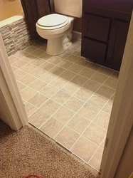 Photo of bathroom tiles near the door