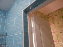 Photo of bathroom tiles near the door