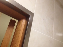 Bathroom door made of tiles photo