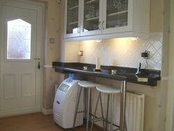 Фото маленькой кухни стол у стены