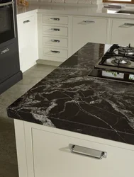 Kitchen with black marble countertop photo