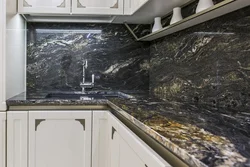 Kitchen with black marble countertop photo