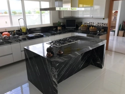 Kitchen with black marble countertop photo