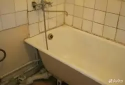 Photo of an old bathroom with tiles