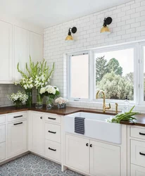 Window design in a white kitchen photo